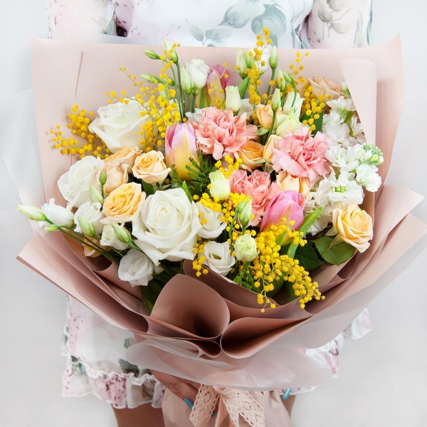 Spray rose: white, cream, light pink 50 cm - 3, White rose 50 cm - 4, Pink carnation - 4, lisianthus - 2, Pink tulip - 4, Mimosa - 2, White Matthiola - 3, Wrapping Paper