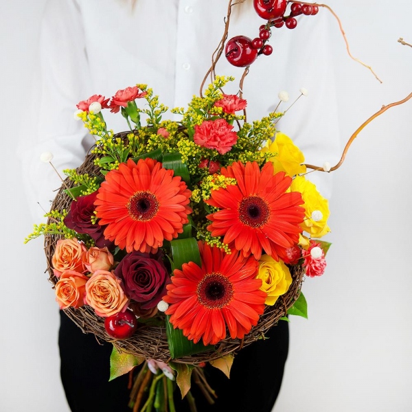 Red rose 50 cm - 3, Yellow rose 50 cm - 4, Gerbera daisies - 4, Pink spray carnation - 4, Spray rose: yellow, orange 50 cm - 2, The frame of the branches, Aspidistra (1 pc.), Solidago (1 pc.), Salal, Dried flowers decor, Artificial branch, Decorative element small, Ribbon