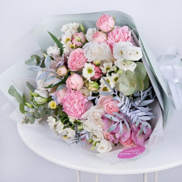Santini White Spray Chrysanthemum - 3, Alstromeria white, soft pink - 2, Carnations - 2, White rose 50 cm - 3, lisianthus - 3, Peony sprayrose - 3, Pistachio, Eucalyptus Cinerea, Wrapping Paper, Ribbon