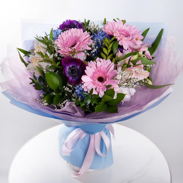 Gerbera pink - 5, Blue Hyacinth - 4, Alstromeria white, soft pink - 5, Freesia - 3, Limonium (1 pc.), Pistachio, Ruscus, Wrapping Paper