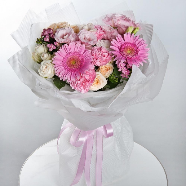 Gerbera pink - 3, Baltica White Spray Chrysanthemum - 1, Spray rose: white, cream, light pink 50 cm - 3, Pink carnation - 9, Pink Lisianthus (Eustoma) - 2,  Bouvardia, Wrapping Paper