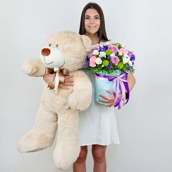 Deep Purple rose - 5, Spray rose: white, cream, light pink 50 cm - 7, Pink carnation - 3, Irises - 3, Athos pom Feeling Green - 2, Round flower box medium, Oasis, Film, Pistachio, Blue Statice, Teddy bear 70 cm, Ribbon