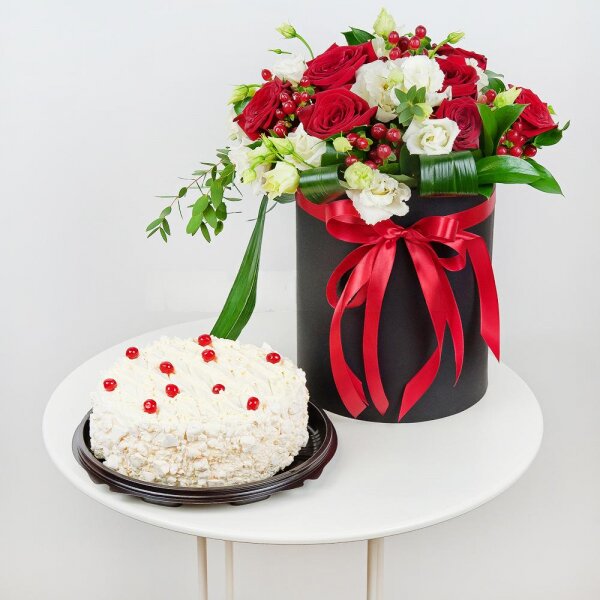 Red rose 50 cm - 9, lisianthus - 5, Round flower box medium, Oasis, Film, Ruscus, Aspidistra (1 pc.), Hypericum, Eucalyptus parvifolia (1 pc.), Cake in assortment, Ribbon